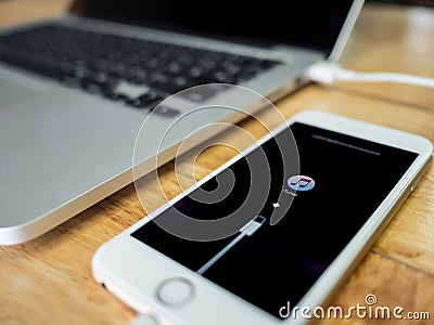 IPhone show connecting with iTunes on screen Editorial Stock Photo