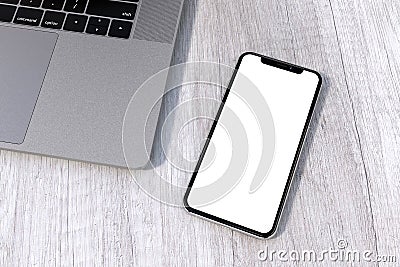 IPhone Xs Silver style smartphone mock-up perspective on table Stock Photo