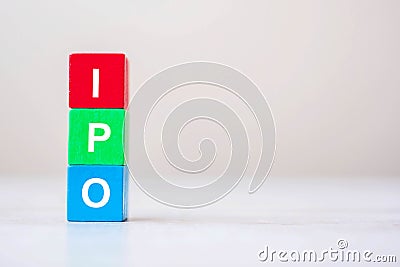 IPO Initial Public Offering word on wooden cube blocks, shares of a private corporation to the public in a new stock issuance. Stock Photo