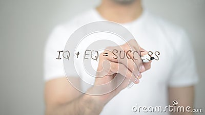 IQ + EQ = Success, man writing on transparent screen Stock Photo