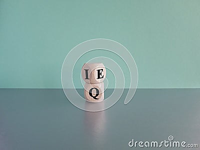 IQ or EQ symbol. Turned cube, changes words IQ, intelligence quotient to EQ Stock Photo