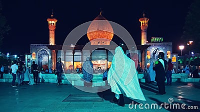 Iran, Shiraz, Mausoleum Shah Cheragh - September 17, 2016: Locals wearing traditional Muslim clothes and tourists in the mausoleum Editorial Stock Photo