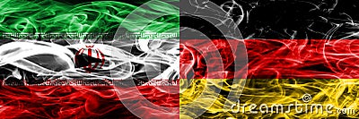Iran vs Germany smoke flags placed side by side. Thick colored silky smoke flags of iranian and Germany. Stock Photo