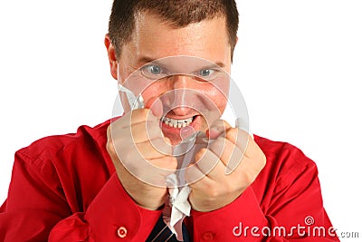 Irate man in red shirt rips sheet of paper Stock Photo