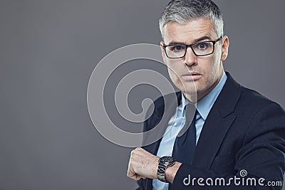 Irate manager or boss glaring at a latecomer Stock Photo