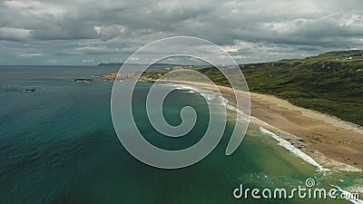 Ireland sand beach aerial view: ocean waves, sandy coastline, white shore, greenery meadow Stock Photo