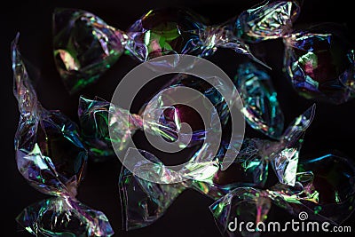 Iridescent hard candies on a dark background Stock Photo