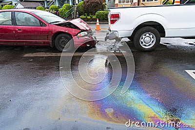 Iridescent oil spill caused by a traffic accident Stock Photo