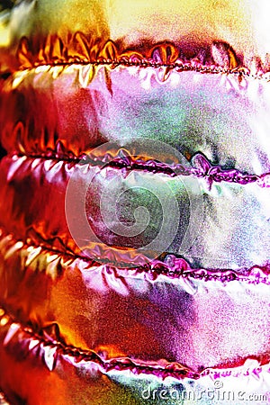 The iridescent texture of the bologna fabric of the quilted youth jacket. Rainbow in trendy style background. Stock Photo