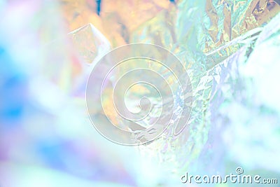 Iridescent texture. Holographic background. A hologram of gradient neon color. Foil effect. Rainbow graphics. Chrome Stock Photo