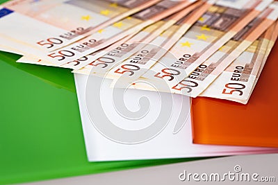 Irish flag and euro money Stock Photo