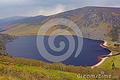 Guiness lake in wicklow mountains in the fog Stock Photo