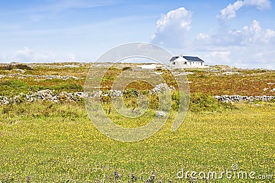 Irish landscape with typical house Aran Island - Europe - Ireland Stock Photo