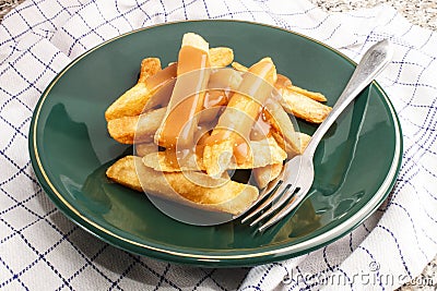 Irish potato chips with gravy on a plate Stock Photo