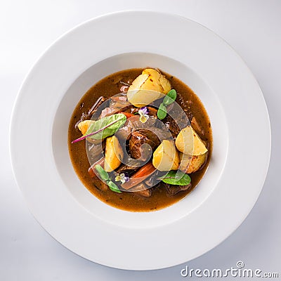 Irish Stew or Guinness Stew made in a crockpot or slow cooker top view, flat lay Stock Photo