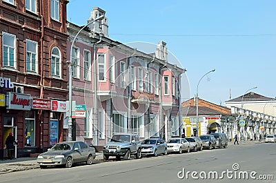 Irkutsk, Russia, March, 16, 2017. Cars on Karl Marx street in Irkutsk in the spring, the house 41. Pre-revolutionary architecture Editorial Stock Photo