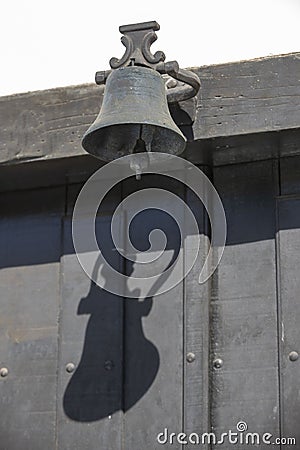 An iron antique bell on door Stock Photo