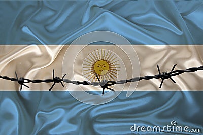 Iron barbed wire against the background of the national silk flag of argentine state, concept imprisonment for offenders, for the Stock Photo