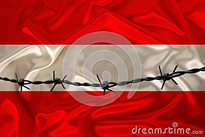 Iron barbed wire against the background of the national silk flag of the state of austria, concept imprisonment for offenders, for Stock Photo