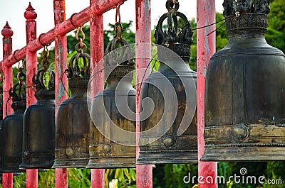 The iron bell on the Red pillar Stock Photo