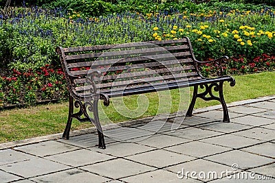 Iron bench on concrete floor Stock Photo