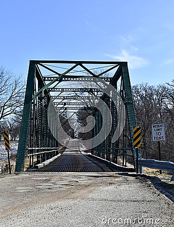 Iron bridge on a rural road Stock Photo