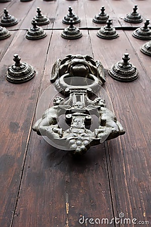 Iron Doorknocker on Wooden Door Stock Photo