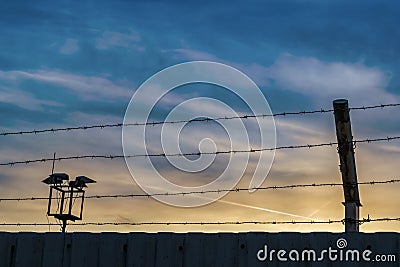 Iron fence with blue sky and sunset Stock Photo