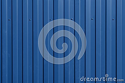 Iron fence with bright red ribs and cogs. Abstract background or texture in bright sunlight. Trendy color 2020 Stock Photo