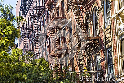 Iron fire ladder at the facade of an old historic house in New York Editorial Stock Photo