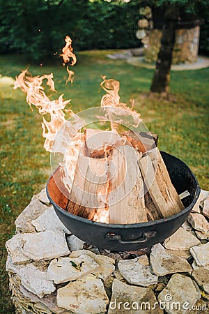 Iron fire pit in garden Stock Photo