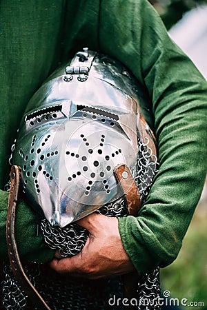 Knight Helmet Of Medieval Suit Of Armour On Table Stock Photo