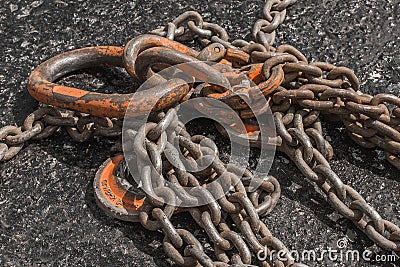 Iron hoist tool hook load heavy lifting weight sling mechanism chain fixed on concrete structure Stock Photo