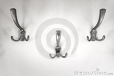 Iron hooks for clothes on the wall Stock Photo