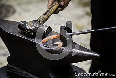 Incandescent iron in an old metal forge Stock Photo