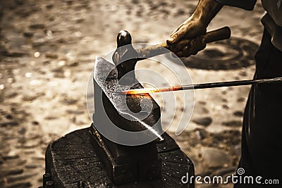 Iron incandescent in an old metal forge Stock Photo