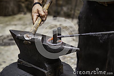 Iron incandescent in an old metal forge Stock Photo