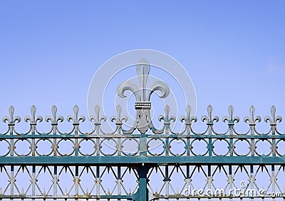 Iron made fleur de lis symbol on a fence Stock Photo