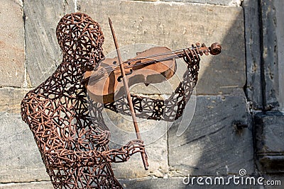 Iron man with a violin Editorial Stock Photo