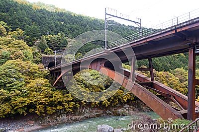 Iron railway bridge over Hozu River in Arashiyama, Japan Stock Photo