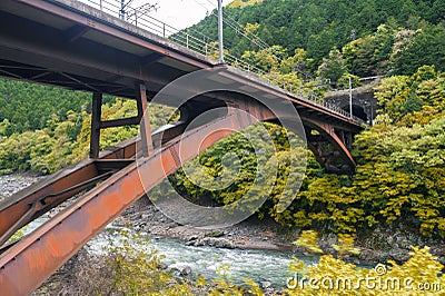 Iron railway bridge over Hozu River in Arashiyama, Japan Stock Photo