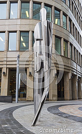 Iron sculpture of a man on the background of the office on the Belorusskaya metro station Editorial Stock Photo