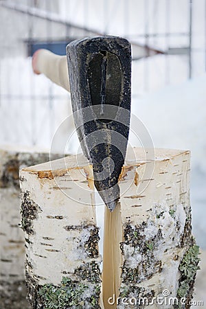 Iron splitting axe in operation Stock Photo