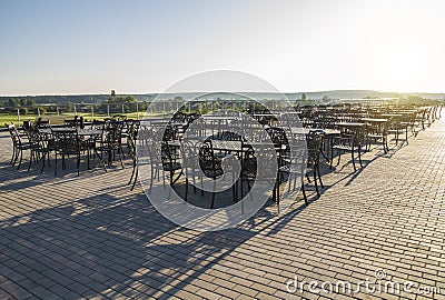 Iron tables and chairs in the street Stock Photo