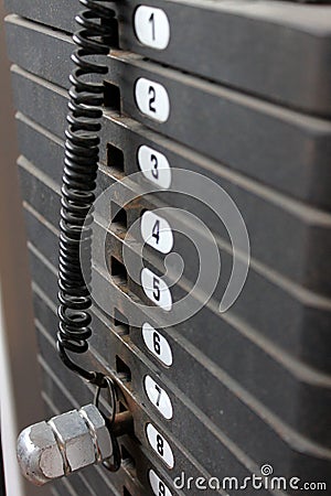 Iron weights on exercise machine,vertical composit Stock Photo