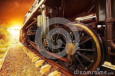 Iron wheels of stream engine locomotive train on railways track Stock Photo