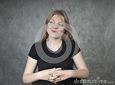 Irony smiling blond girl Stock Photo