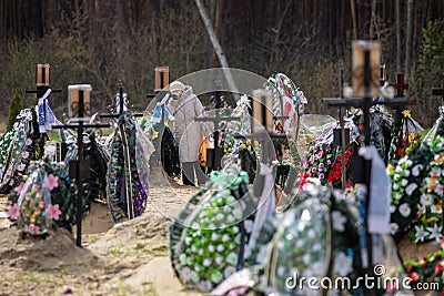 Irpin cemetery full of fresh graves of civilian people Editorial Stock Photo