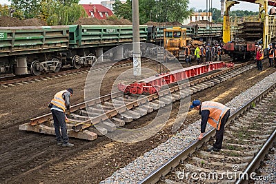 Repair workers modernize the Irpin-Bucha railway line on Kiev region. Editorial Stock Photo