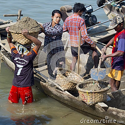 Burmese workers carrying sand Editorial Stock Photo